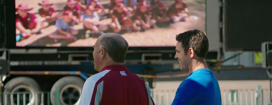 Wally Lewis and Brad Fittler in front of a screen